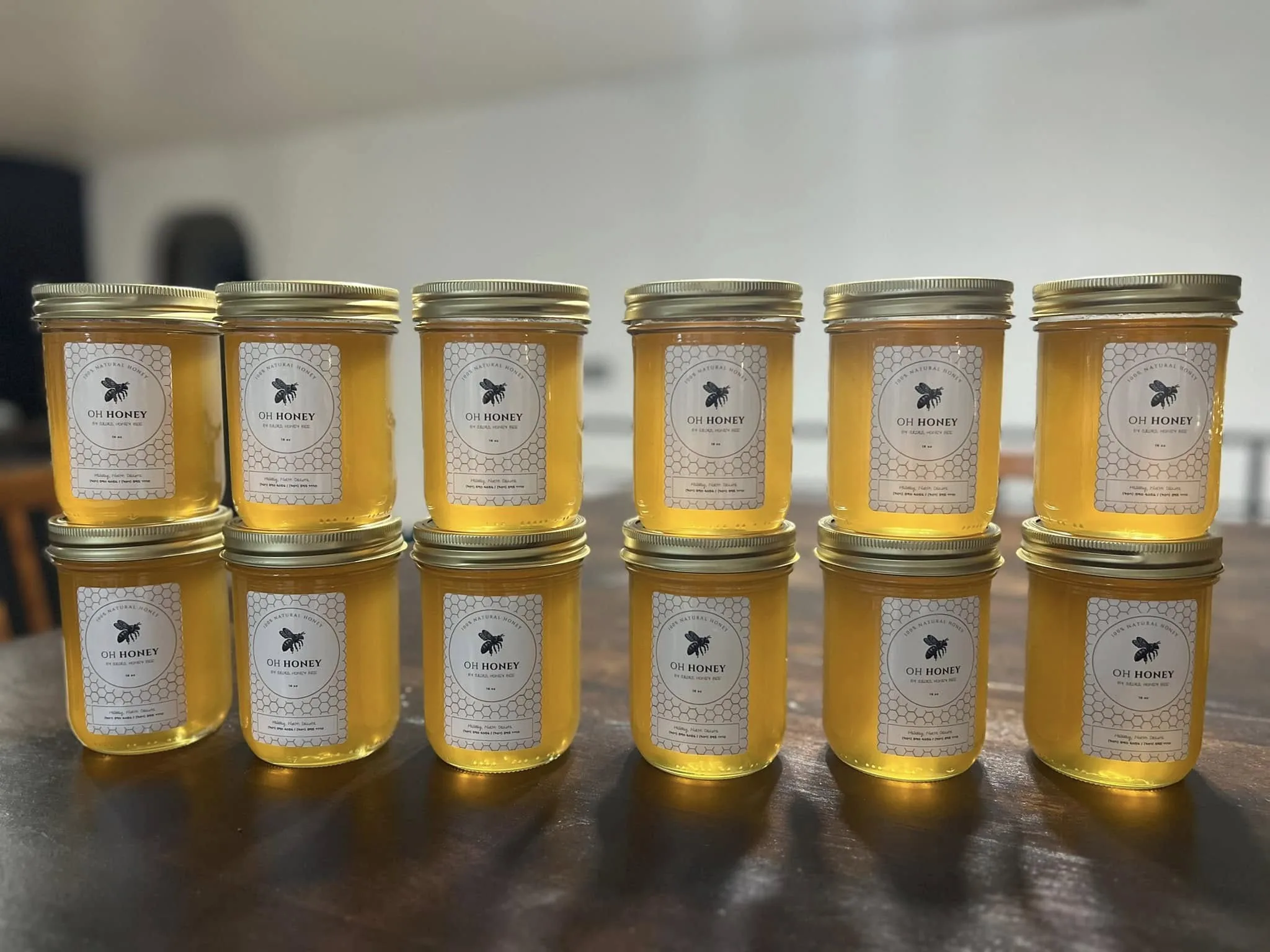A row of honey jars on the market table